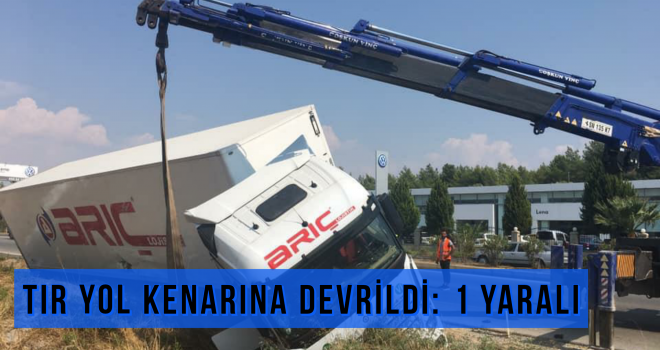 TIR YOL KENARINA DEVRİLDİ: 1 YARALI